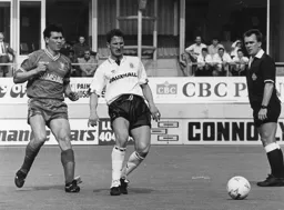 Dave Beaumont gets the ball of Laurie Sanchez