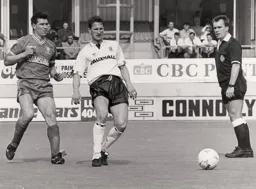 Dave Beumont gets in ahead of Lawrie Sanchez