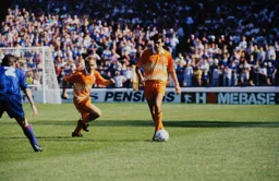 John Dreyer holds the ball ready for David Preece to get into position