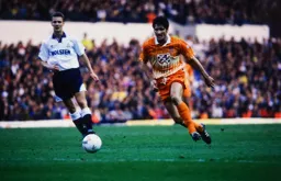 Mick Harford bursts through the middle