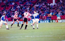 Richard Harvey holds up a Utd attack