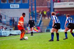 Brian Steen holding the ball near the touch line