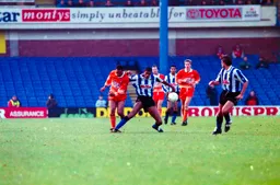 Brian Stein held off the ball by Carlton Palmer