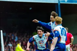 Mick Harford takes the congratulations of his teammates