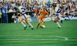 Kingsley Black jinks between two Rangers defenders