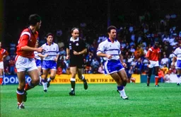 Phil Gray being watched closely by referee David Ellery