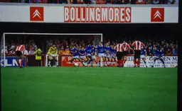 Andy Petterson behind a long defensive wall