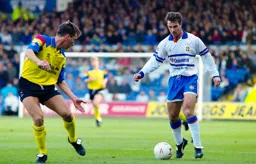 Phil Gray about to take on a Derby defender