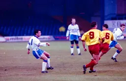 Jason Rees sending a through pass upfield