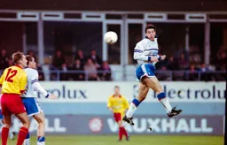 Phil Gray gets his head to the ball