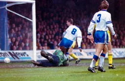 Ian Benjamin slides the ball home