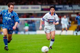 Ceri Hughes about to challenge Blues defender