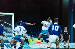 Ian Benjamin has the ball fly past him