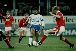 Chris Kamara is surrounded
