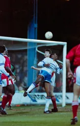 Ian Benjamin gets up to head the ball