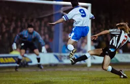 Jason Rees jumps high to evade the tackle