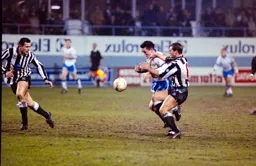 Paul Telfer tussles with a Newcastle defender