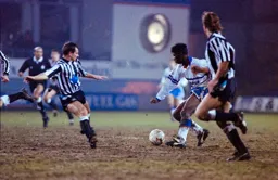 Martin Williams ploughs through the mud