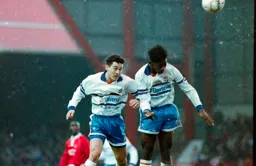 Paul Telfer and Martin Williams go for the same ball