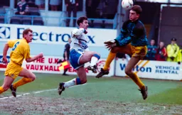 Phil Gray chips the keeper on to see it go past the post