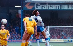 Scott Oakes first to the ball