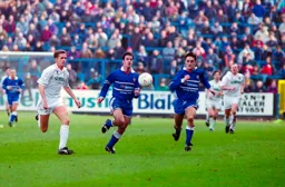 Phil Gray and Scott Oakes chase down the same ball