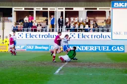 Kerry Dixon just beaten to the ball by the keeper