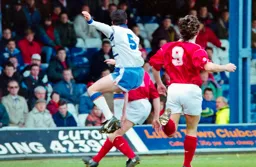 Ceri Hughes gets his head to the ball