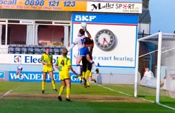 Phil Gray challenging with the keeper