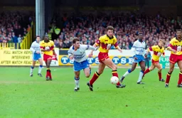 Phil Gray challenging a Hornets defender