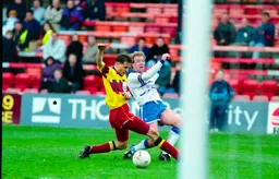 Kerry Dixon gets to the ball first