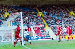 Phil Gray can do nothing as the keeper catches easily