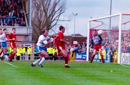 Kerry Dixon cannot get past Swindon’s Glen Hoddle