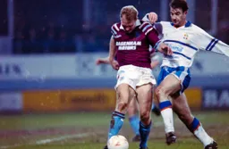 Phil Gray about to tackle Luton old boy Tim Breacker