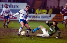 Kerry Dixon trying to round the keeper