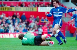 Phil Gray has the ball taken off his foot