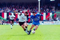 Ceri Hughes swerves past his marker