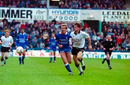 Kerry Dixon in a race for the ball