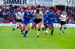 Kerry Dixon with a tight grip on the defender