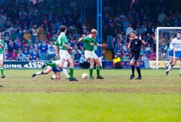 John Dreyer watches on as the referee blows for a free kick