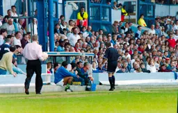 Referee having a word with the Town bench