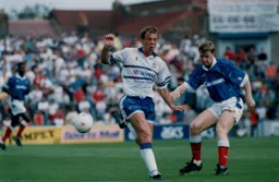 The ball goes across Kerry Dixon and Andy Awford