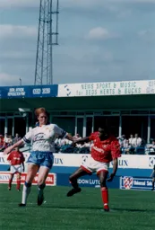 John Hartson holds off Vance Warner