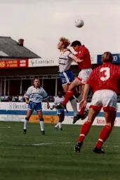 John Hartson leaps to meet a high ball