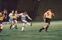 John Hartson has a shot from long range