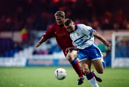 Scott Houghton goes forward with the ball