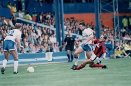 Ceri Hughes is slide tackled by Jason McAteer