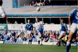 Alan Harper plays a high ball forward