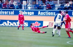 Marvin Johnson watches on as City player gets a shot away