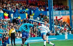 Scott Oakes moves in to block a clearance